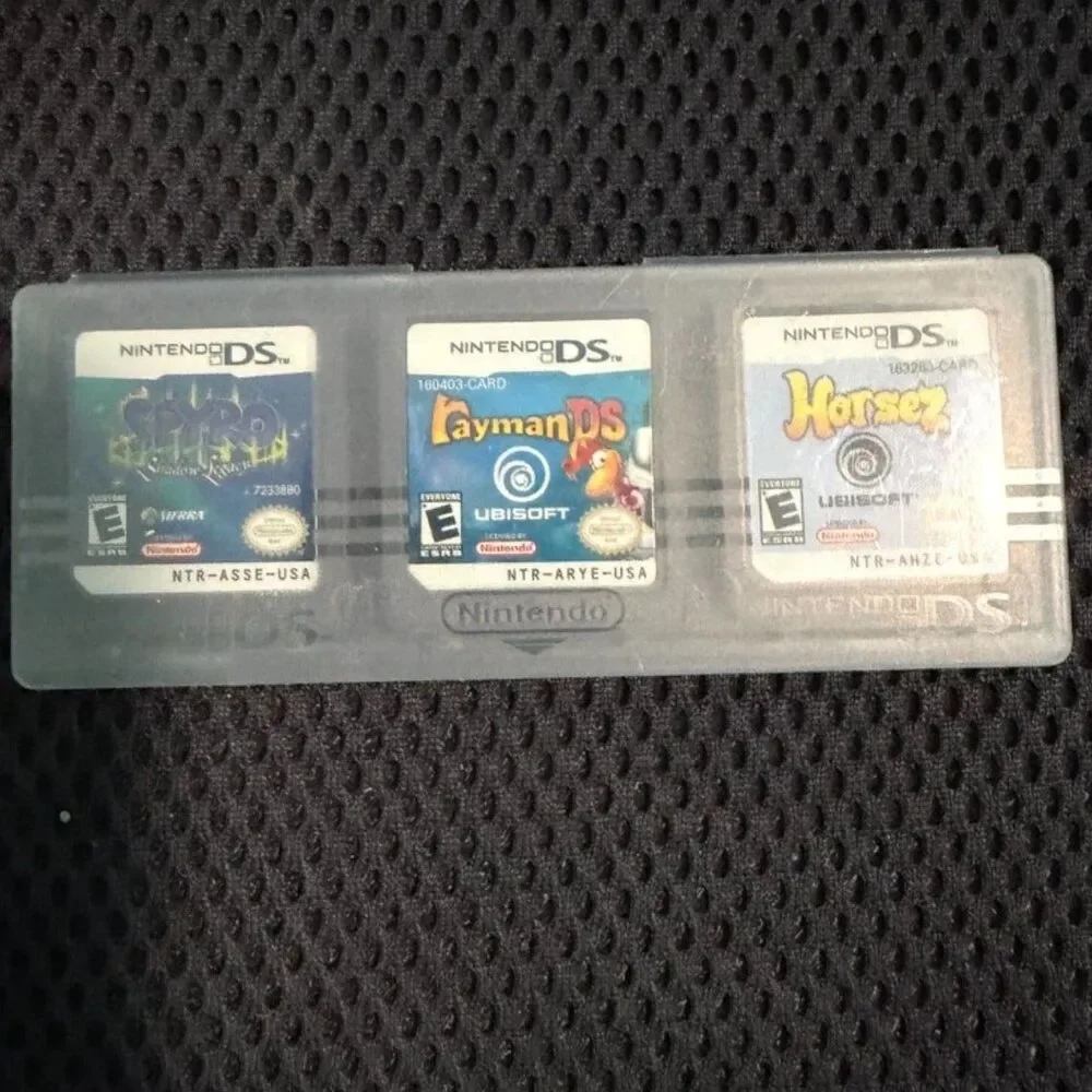 Red nintendo DS with charger and 3 games gently used